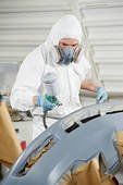 david nash smash repairs worker spray painting a car bumper